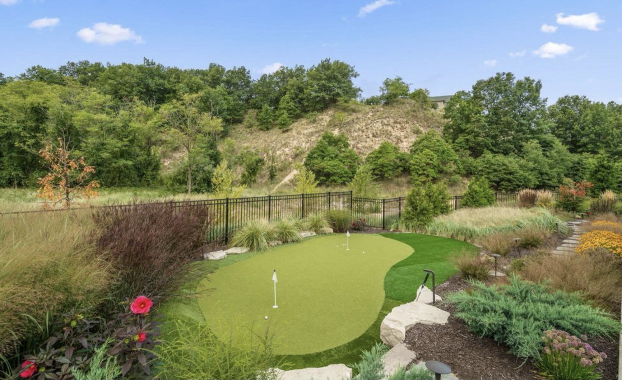 Private putting green nestled against the dunes